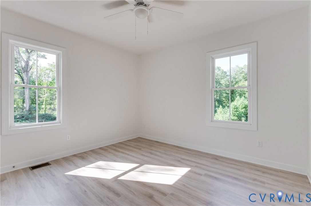 1393 Broad St Road Oilville, VA 23129 - Photo 18 of 39 Empty room featuring light wood-style flooring and
