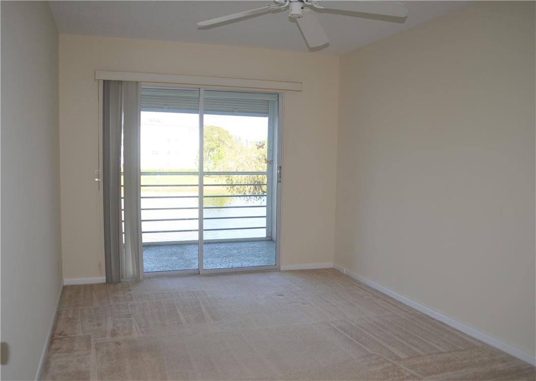2006 Guildford East, Unit 2006 Boca Raton, FL 33434 - Photo 19 of 26 Second bedroom with access to balcony