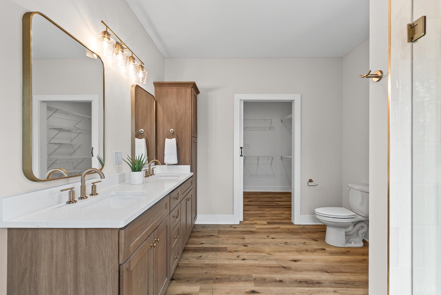 2441 River Road Madison Heights, VA 24572 - Photo 17 of 45 a bathroom with a double vanity sink toilet and shower