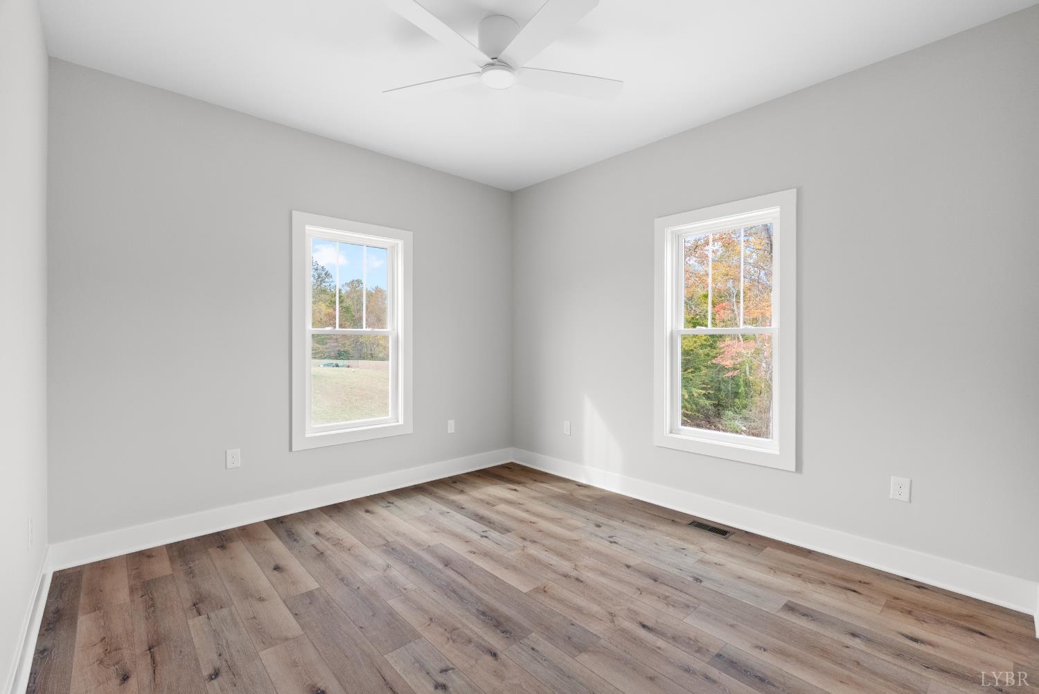 2441 River Road Madison Heights, VA 24572 - Photo 25 of 45 an empty room with wooden floor and windows