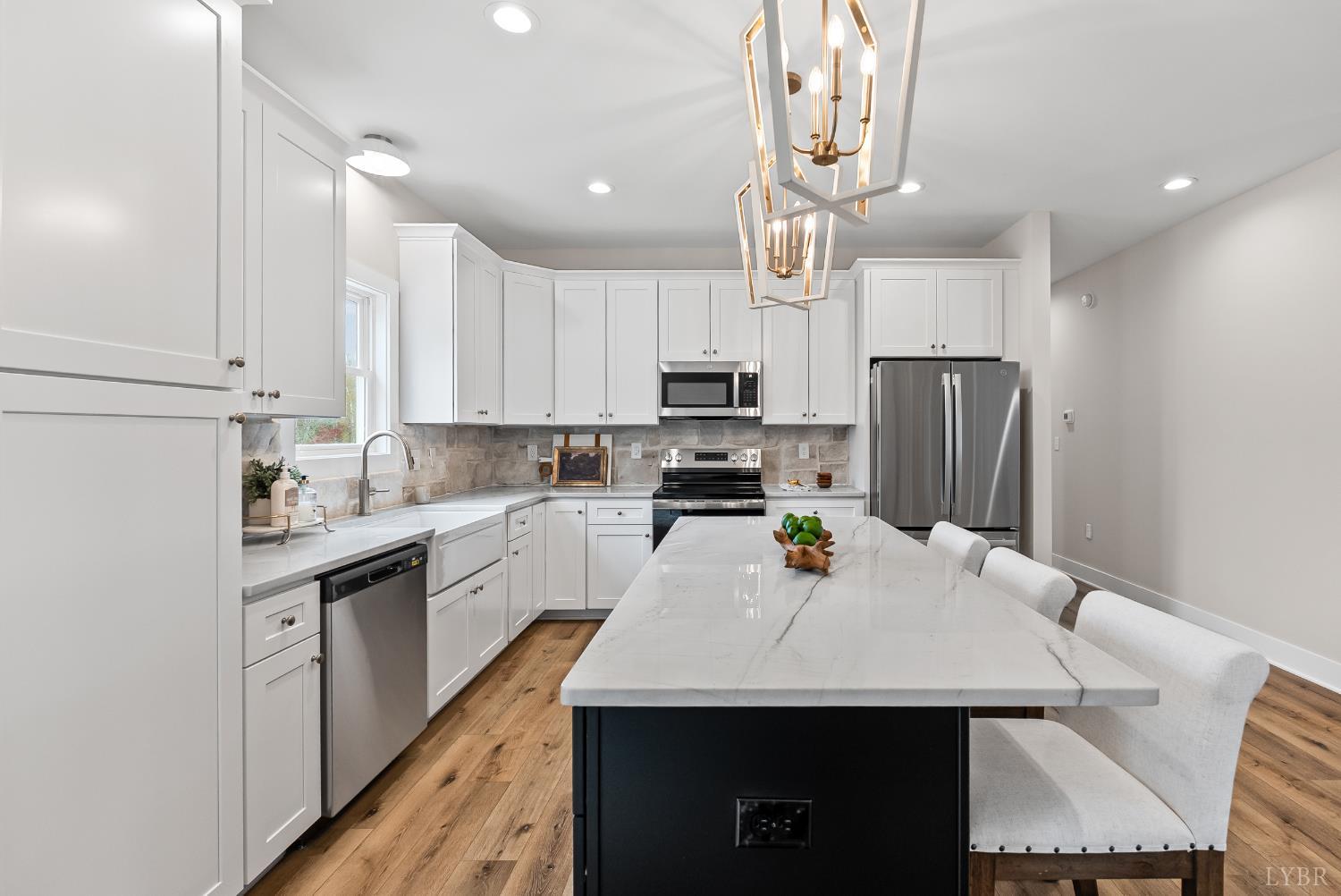 2441 River Road Madison Heights, VA 24572 - Photo 10 of 45 a kitchen with stainless steel appliances a sink a stove a refrigerator and cabinets