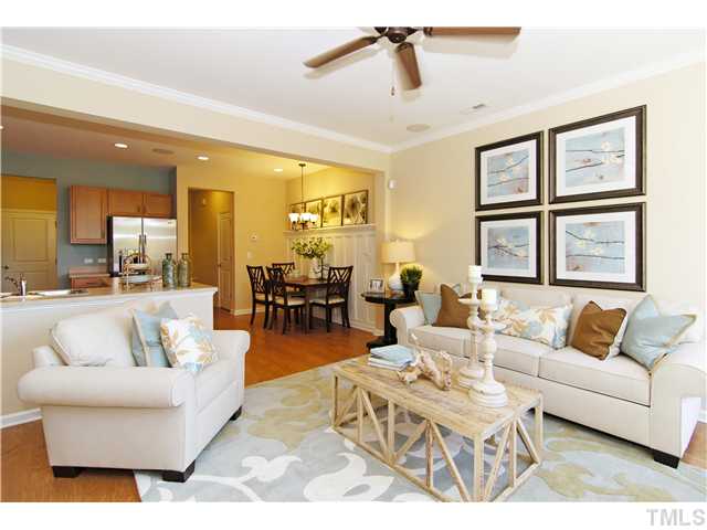 759 Wickham Ridge Road, Unit 105 Apex, NC 27539 - Photo 11 of 25 a living room with furniture and a large window