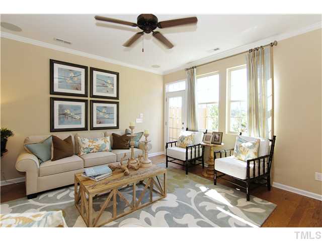 759 Wickham Ridge Road, Unit 105 Apex, NC 27539 - Photo 12 of 25 a living room with furniture and a large window