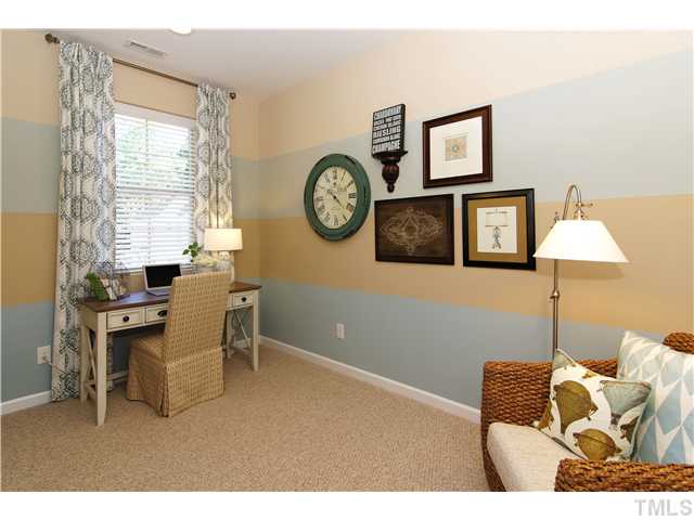 759 Wickham Ridge Road, Unit 105 Apex, NC 27539 - Photo 19 of 25 a living room with furniture and a window