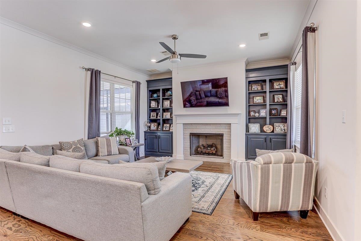 a living room with furniture and a fireplace
