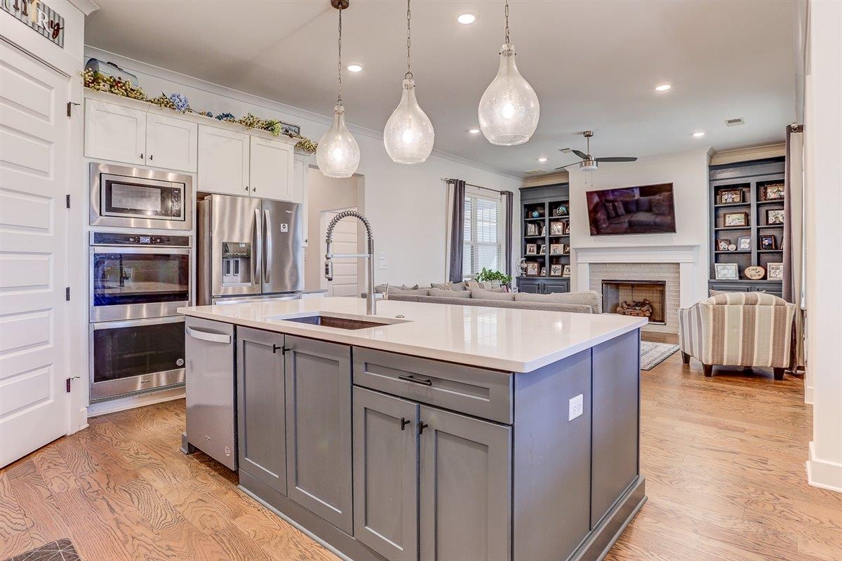 5566 Gerber Road Arlington, TN 38002 - Photo 15 of 33 a kitchen with cabinets and stainless steel appliances