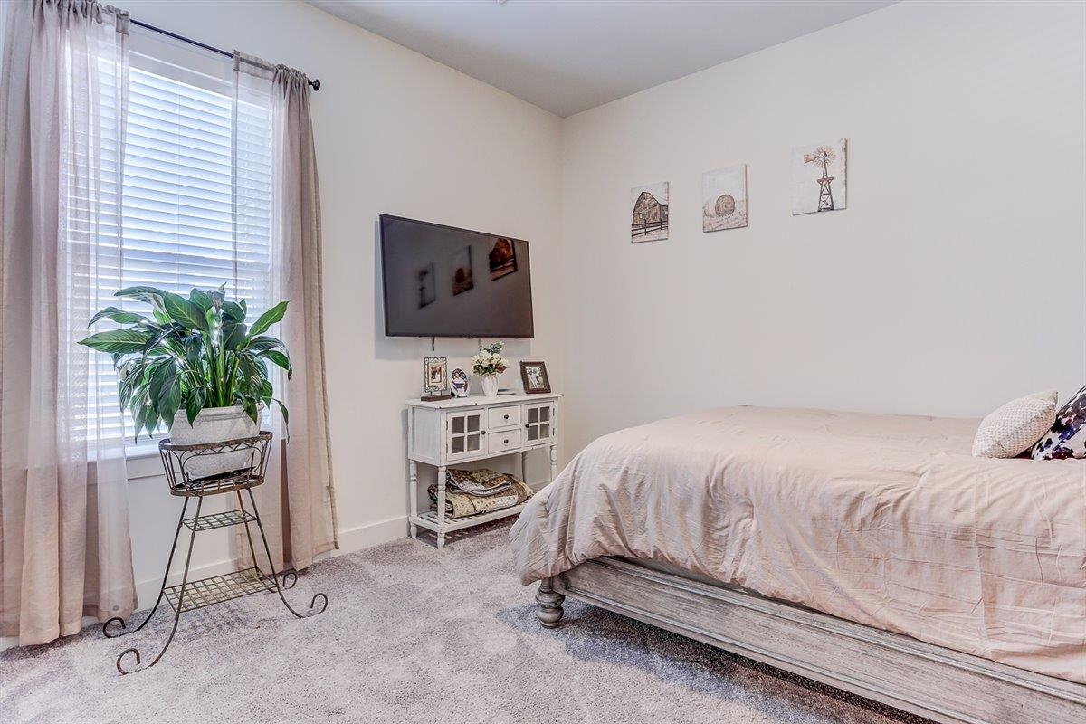 5566 Gerber Road Arlington, TN 38002 - Photo 19 of 33 a bedroom with a bed and a flat screen tv