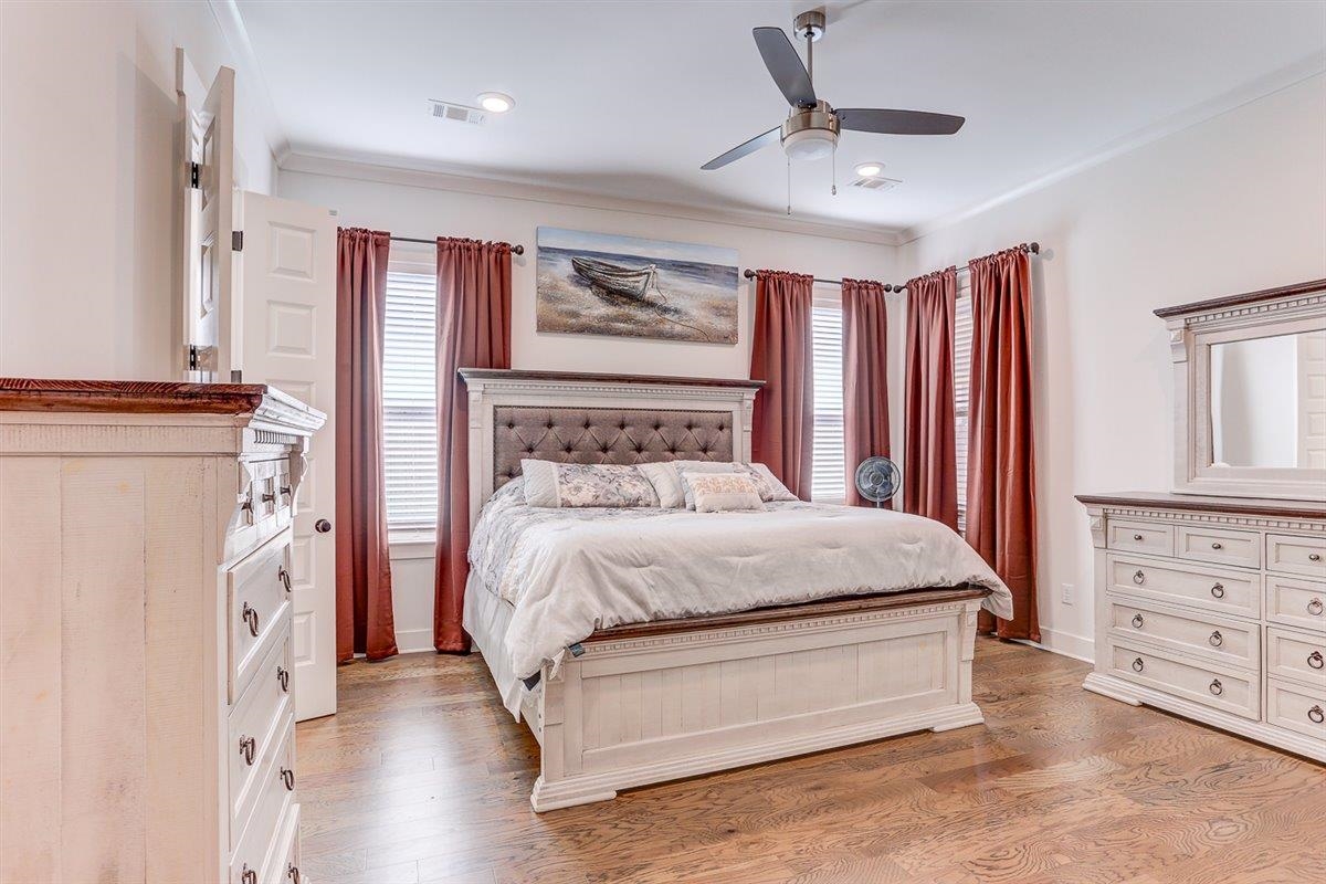 5566 Gerber Road Arlington, TN 38002 - Photo 21 of 33 a spacious bedroom with a bed a window and a chandelier