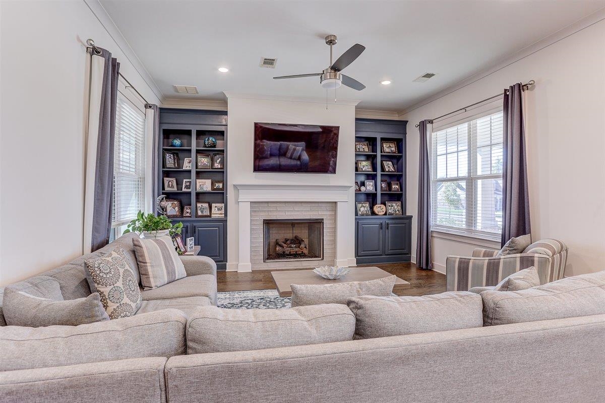 5566 Gerber Road Arlington, TN 38002 - Photo 9 of 33 a living room with furniture and a fireplace