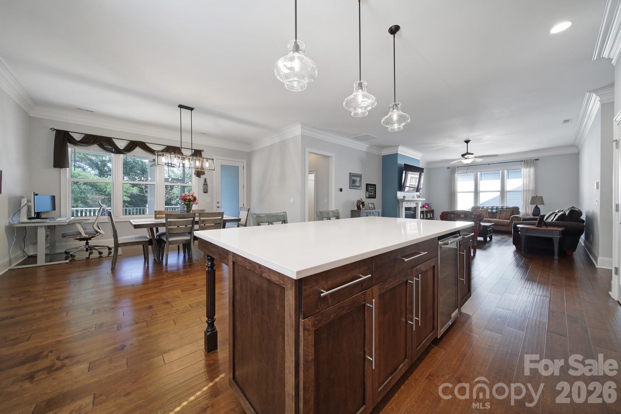 1633 Half Pint Loop Fort Mill, SC 29708 - Photo 12 of 48 a kitchen with a stove center island wooden floor and a chandelier