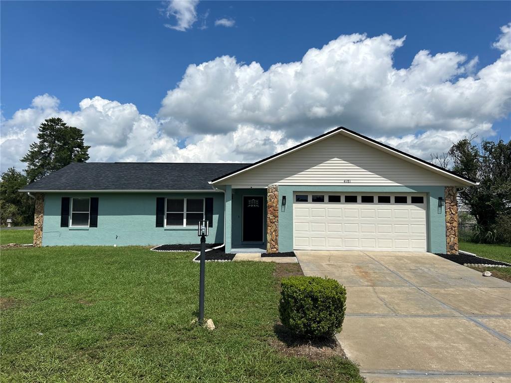 4181 Southwest 139th St Road Ocala, FL 34473 - Photo 1 of 1 a front view of a house with garden