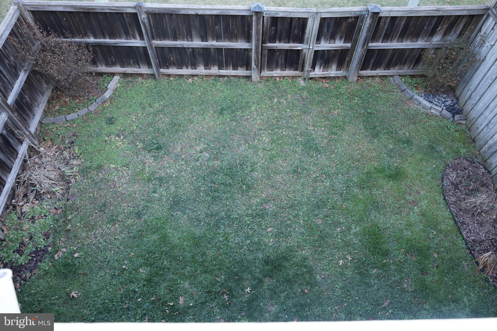 21543 Trowbridge Square Ashburn, VA 20147 - Photo 14 of 60 a view of an empty room with empty shelves