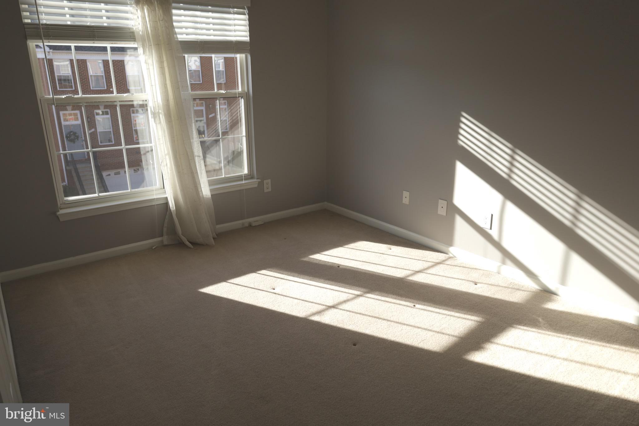 21543 Trowbridge Square Ashburn, VA 20147 - Photo 19 of 60 a view of an empty room with a window