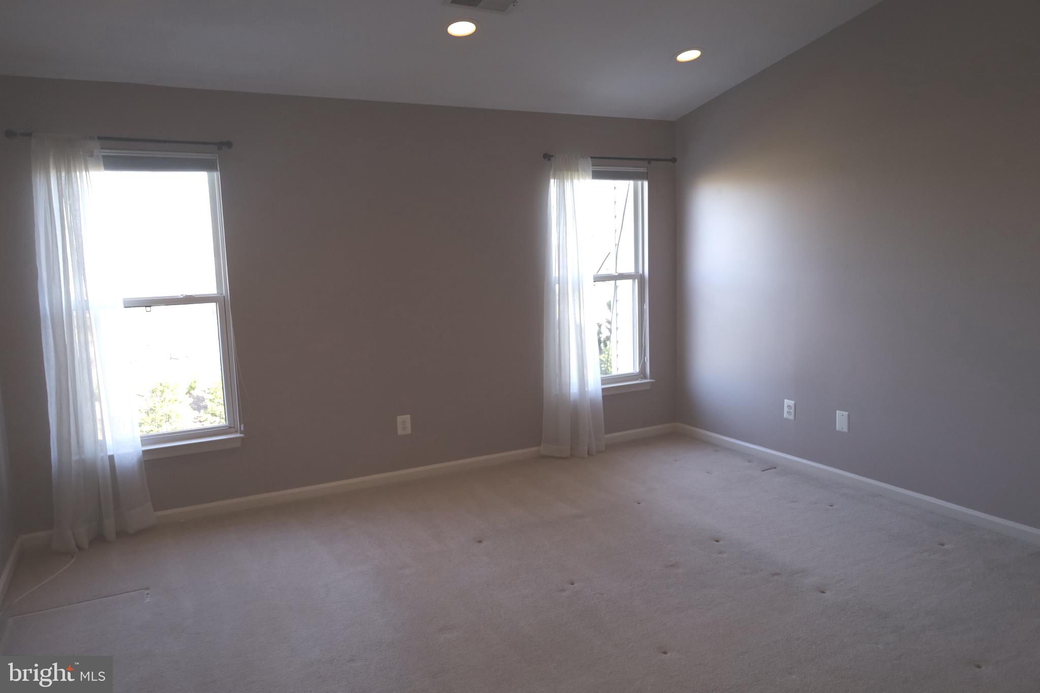 21543 Trowbridge Square Ashburn, VA 20147 - Photo 30 of 60 an empty room with windows