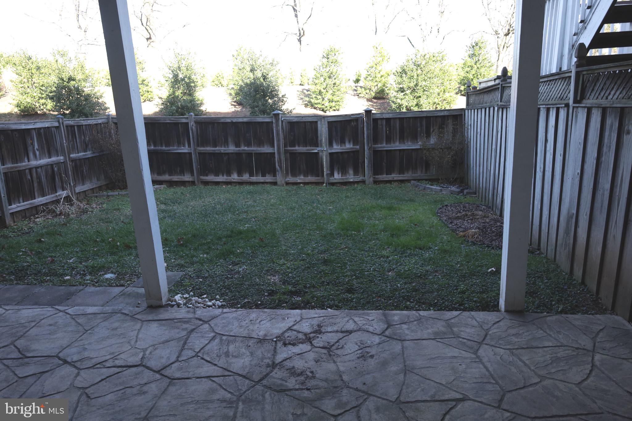 21543 Trowbridge Square Ashburn, VA 20147 - Photo 44 of 60 a view of a backyard with a small cabin and a chair