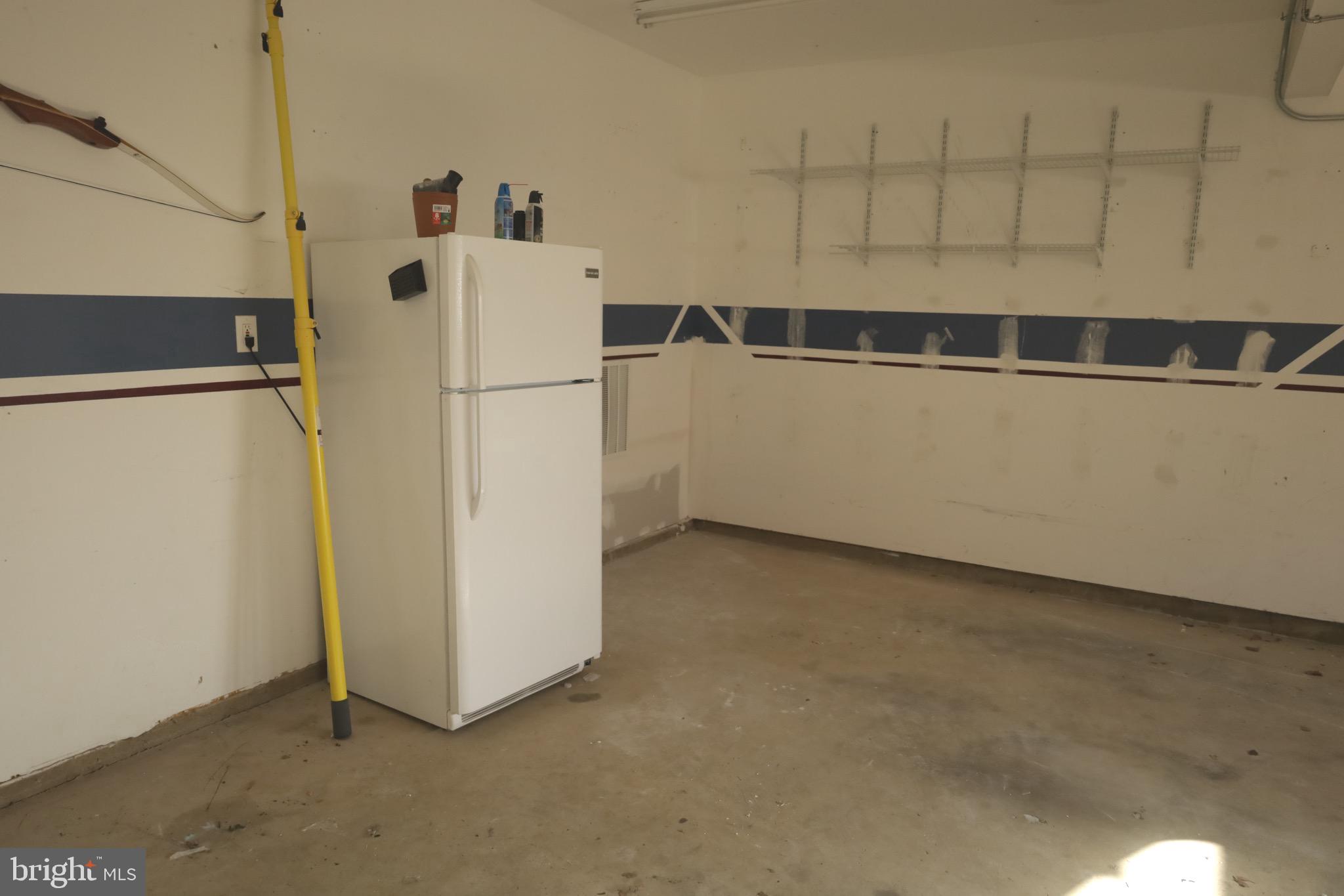 21543 Trowbridge Square Ashburn, VA 20147 - Photo 50 of 60 a view of storage and utility room with refrigerator