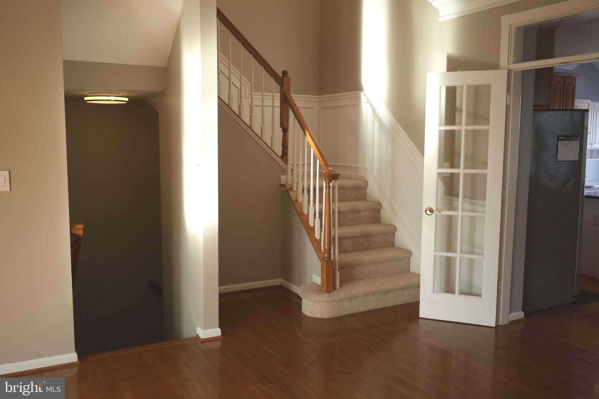 21543 Trowbridge Square Ashburn, VA 20147 - Photo 8 of 60 a view of entryway and hall with wooden floor