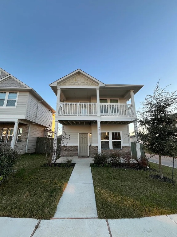 9613 Grapevine Leaf Drive Manor, TX 78653 - Photo 1 of 15 a front view of a house with a yard