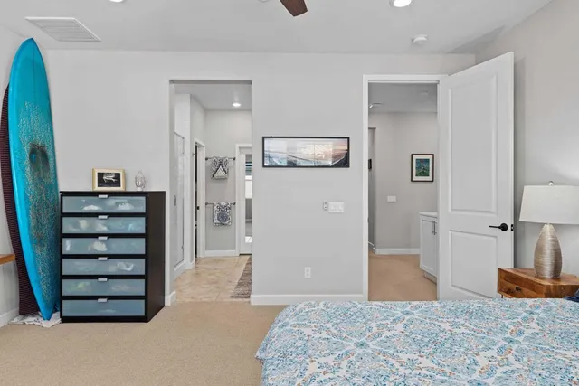 a bedroom with a bed and a cabinets