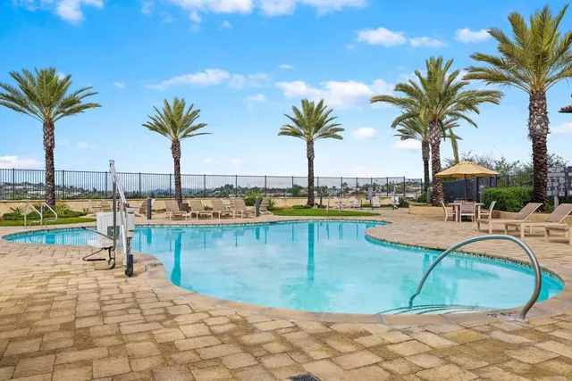 a view of a swimming pool and lounge chair