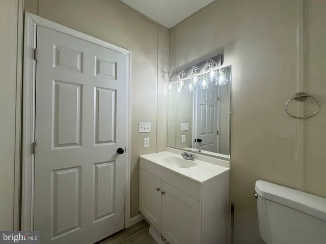 a bathroom with a double vanity sink and mirror