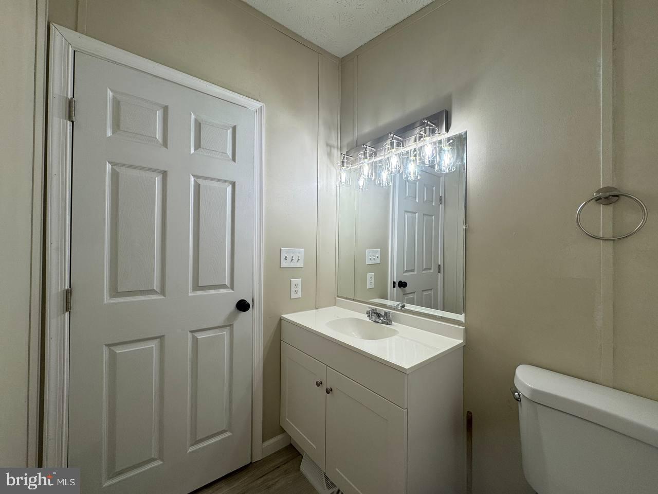 235 Poclain Road Aberdeen, MD 21001 - Photo 11 of 28 a bathroom with a double vanity sink and mirror