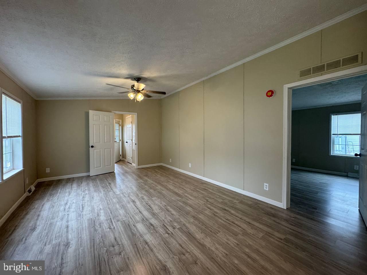 235 Poclain Road Aberdeen, MD 21001 - Photo 16 of 28 an empty room with wooden floor and windows