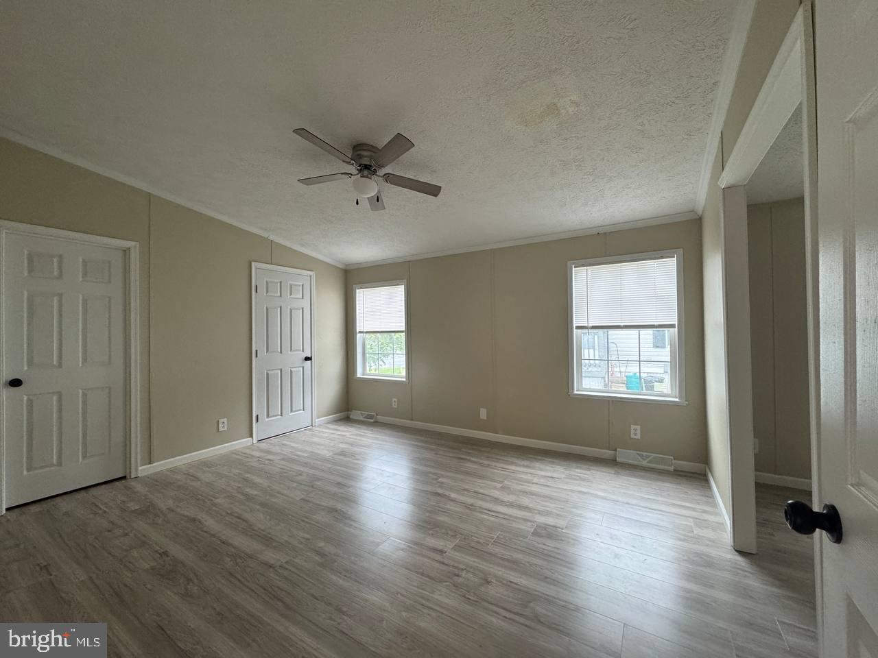 235 Poclain Road Aberdeen, MD 21001 - Photo 17 of 28 a view of an empty room with a window and wooden floor