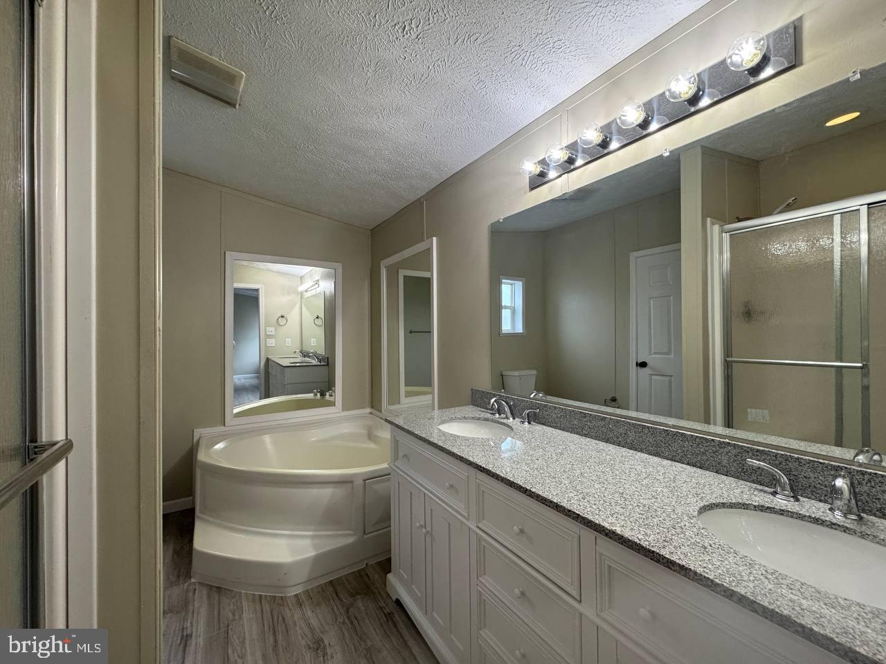 235 Poclain Road Aberdeen, MD 21001 - Photo 20 of 28 a bathroom with a granite countertop sink and a mirror