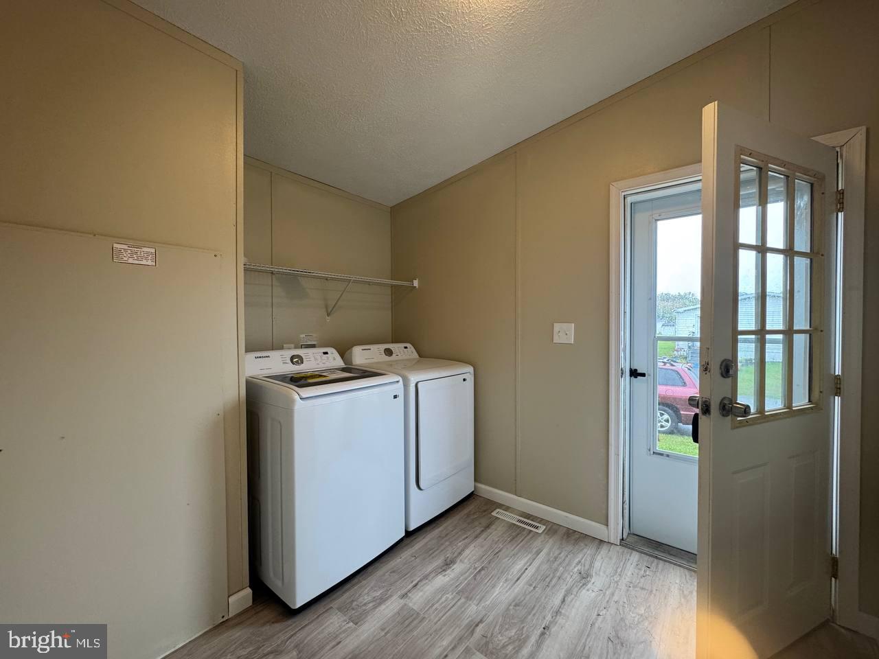 235 Poclain Road Aberdeen, MD 21001 - Photo 26 of 28 a utility room with wooden floor washer and dryer