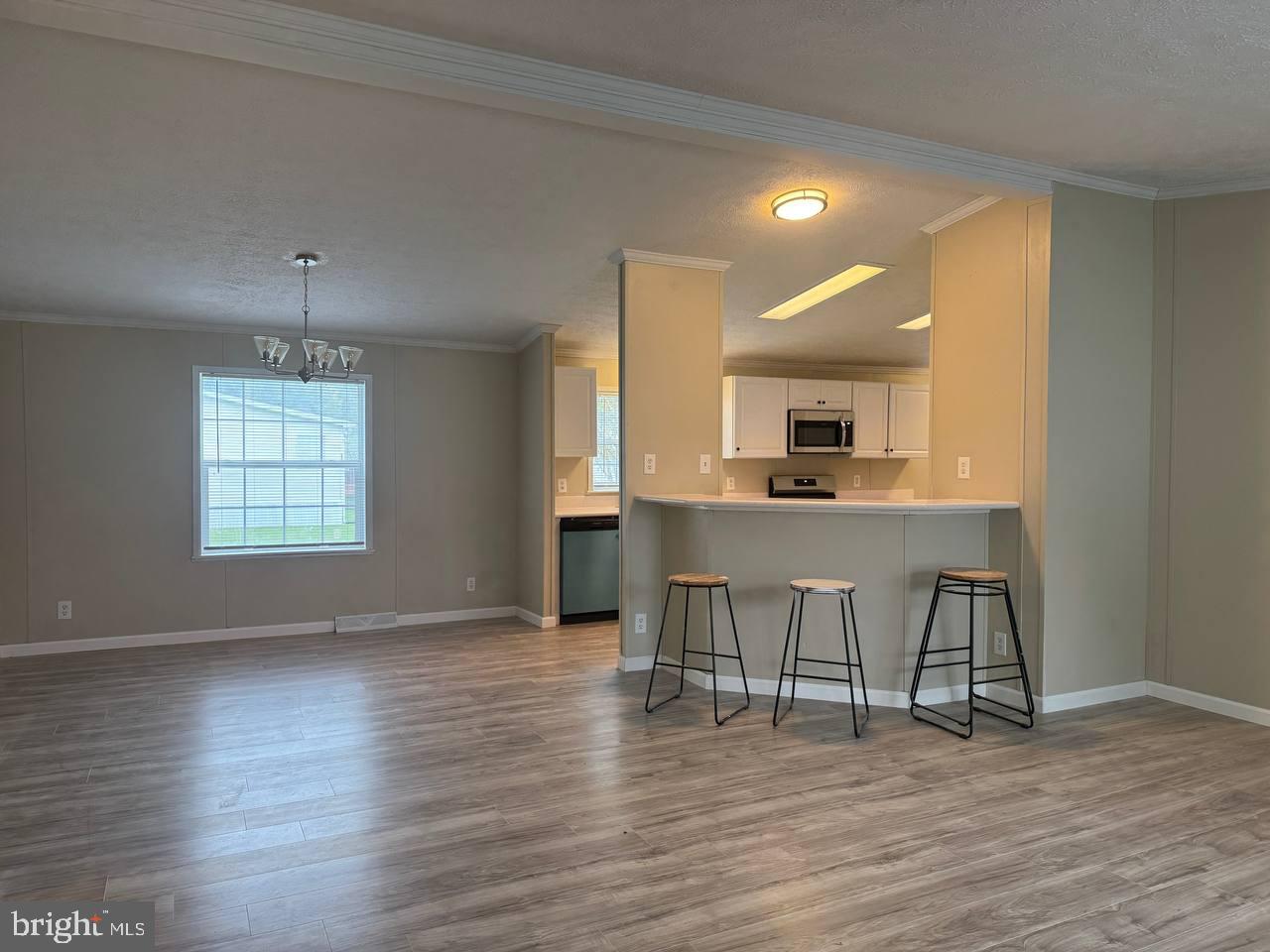 235 Poclain Road Aberdeen, MD 21001 - Photo 4 of 28 a view of a kitchen with dining table and chairs