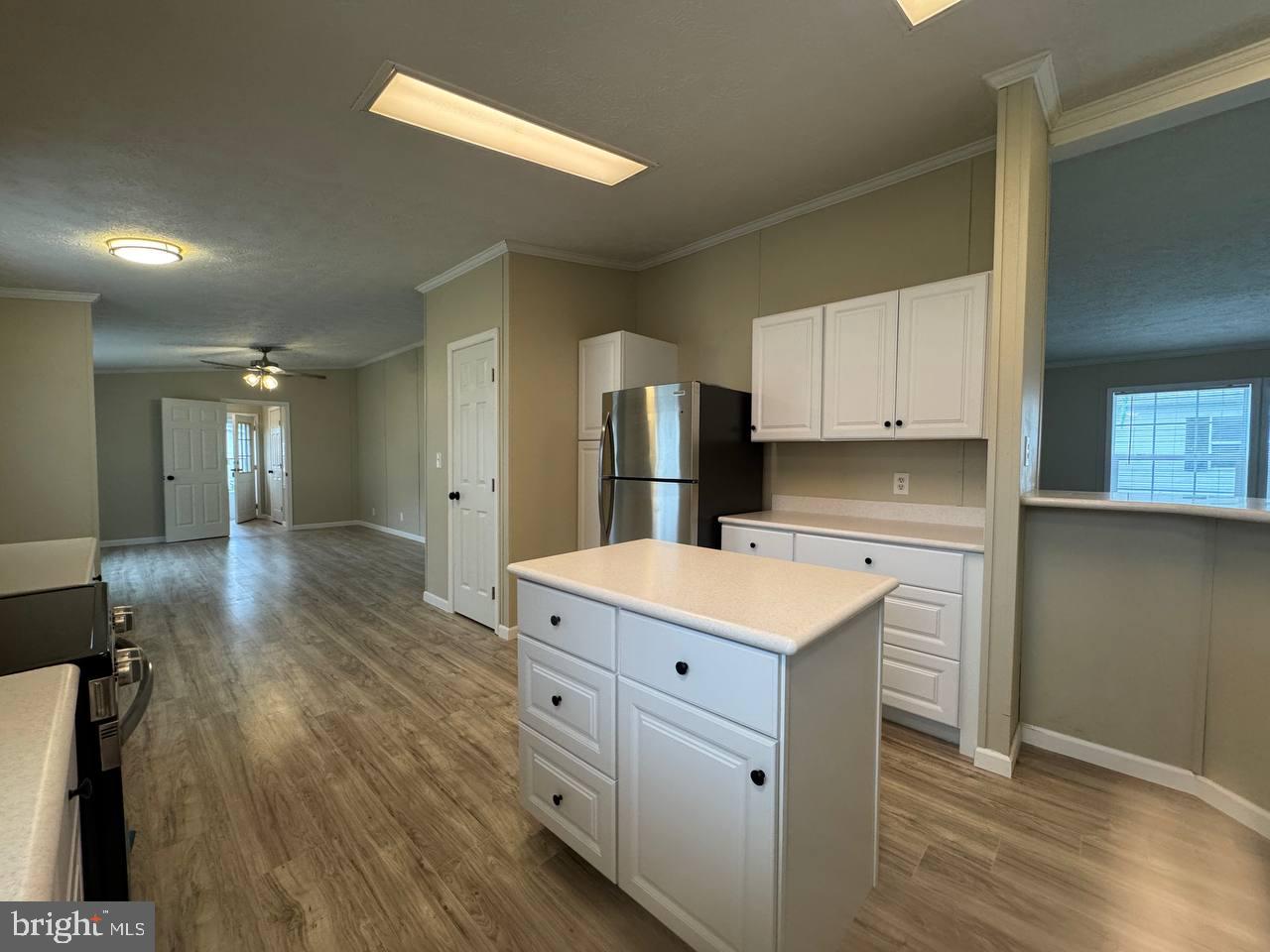 235 Poclain Road Aberdeen, MD 21001 - Photo 7 of 28 a kitchen with a stove a refrigerator and a sink