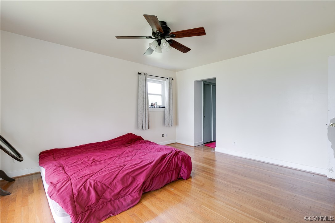 900 Jordan Point Road Hopewell, VA 23860 - Photo 18 of 41 a bedroom with a bed and a ceiling fan