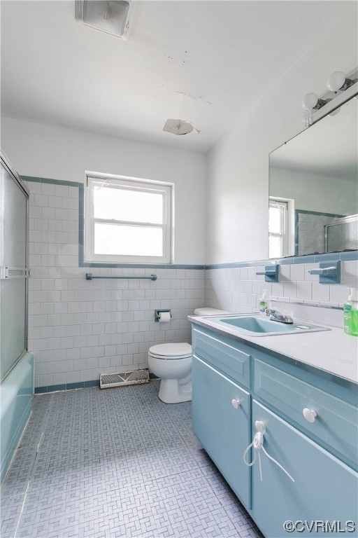 900 Jordan Point Road Hopewell, VA 23860 - Photo 21 of 41 a bathroom with a granite countertop toilet a sink and a mirror