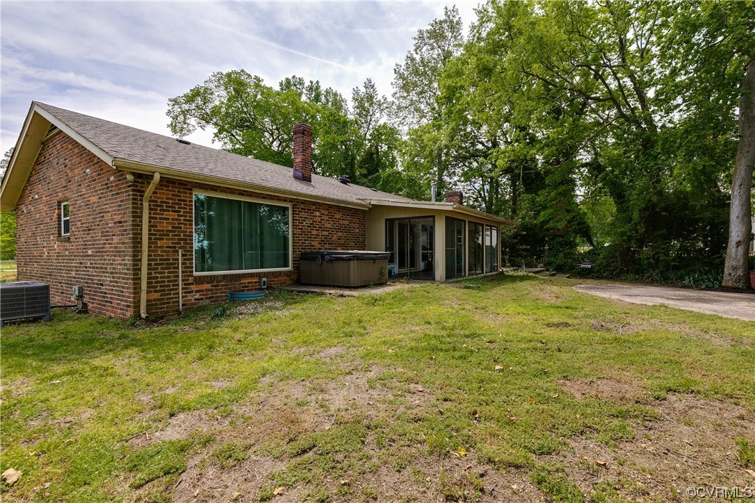 900 Jordan Point Road Hopewell, VA 23860 - Photo 34 of 41 a backyard of a house with yard and trampoline