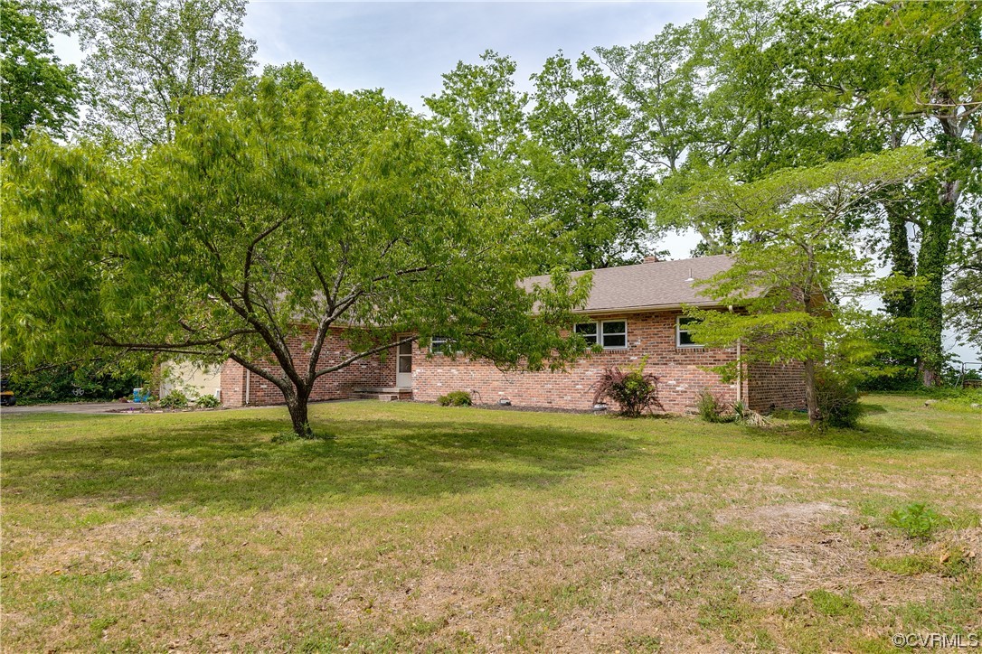 900 Jordan Point Road Hopewell, VA 23860 - Photo 7 of 41 a view of a trees in front of a house with a big yard