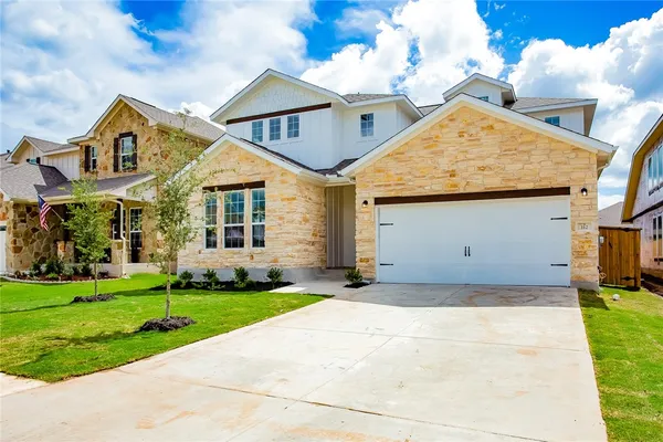 a view of a yard in front of a house