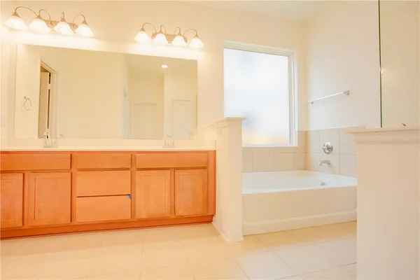 a bathroom with a bathtub and a sink