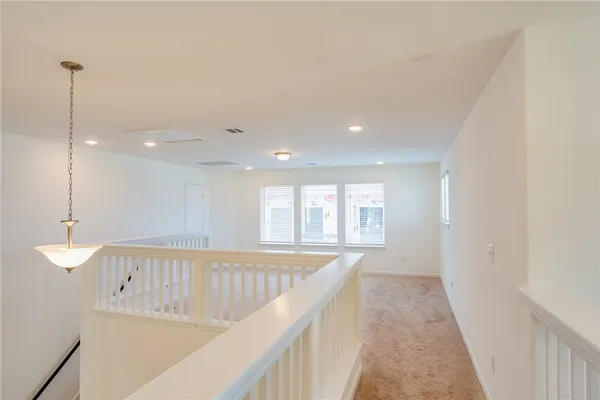 a view of a kitchen and an entryway