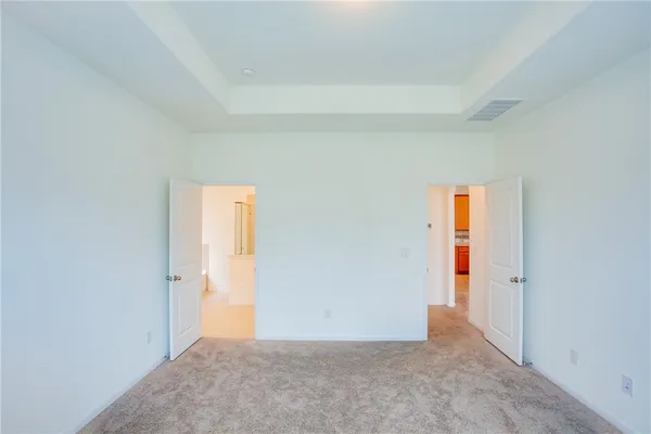an empty room with an entryway door