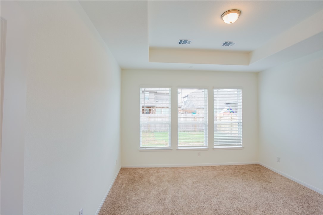 112 Rebel Red Road Liberty Hill, TX 78642 - Photo 21 of 29 a view of an empty room with a window