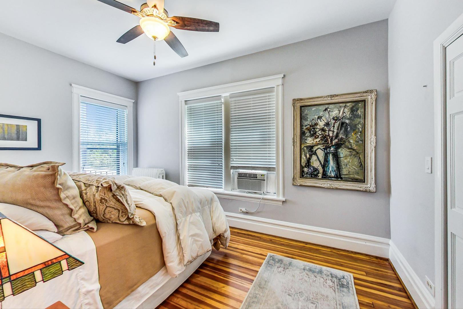 1934 West Grace Street Chicago, IL 60613 - Photo 12 of 34 a bedroom with a bed and a painting on the wall