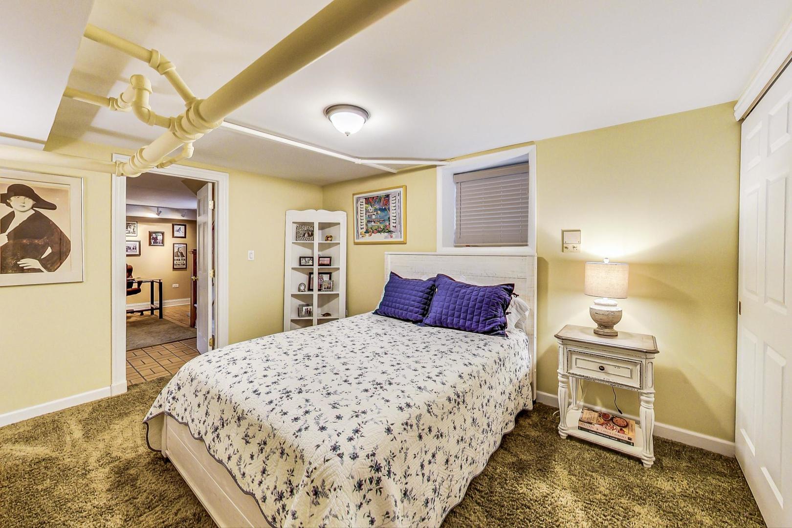 1934 West Grace Street Chicago, IL 60613 - Photo 18 of 34 a bedroom with a bed and a cabinets