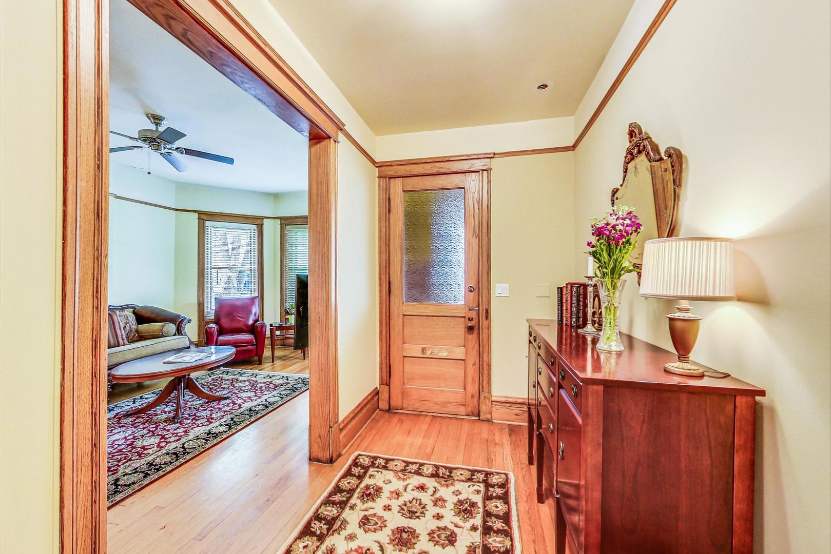 1934 West Grace Street Chicago, IL 60613 - Photo 5 of 34 a very nice looking room with a red couch