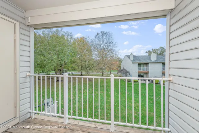 a balcony with a yard