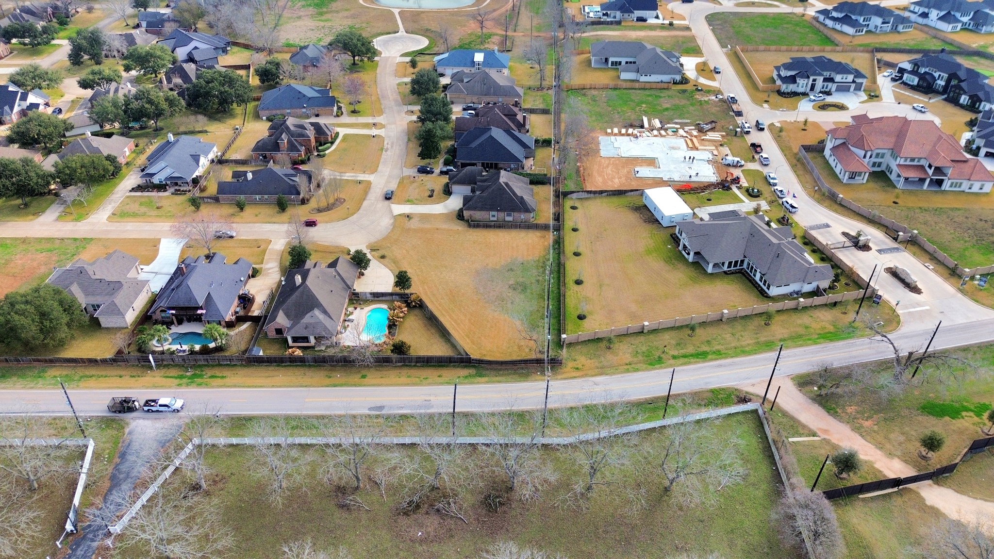 33231 Worthing Lane Fulshear, TX 77441 - Photo 13 of 28 an aerial view of residential houses with outdoor space