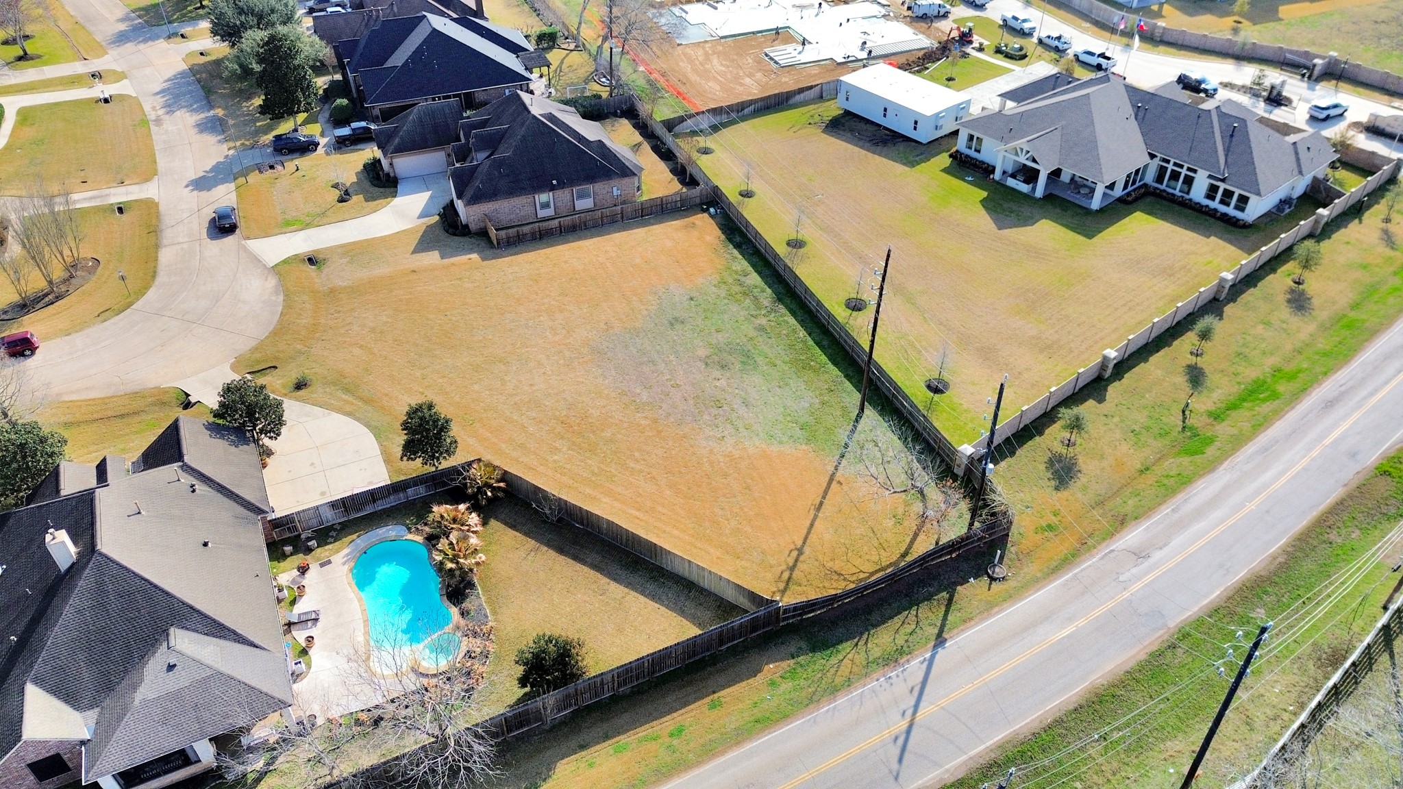 33231 Worthing Lane Fulshear, TX 77441 - Photo 17 of 28 a view of houses and swimming pool