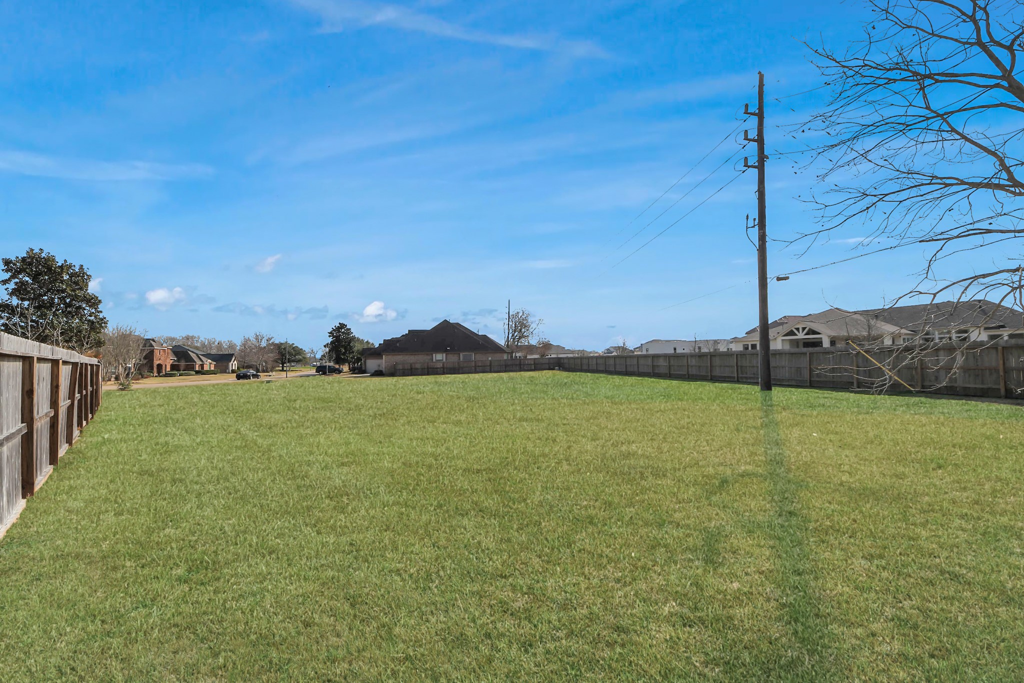 33231 Worthing Lane Fulshear, TX 77441 - Photo 25 of 28 a view of a big yard next to a house