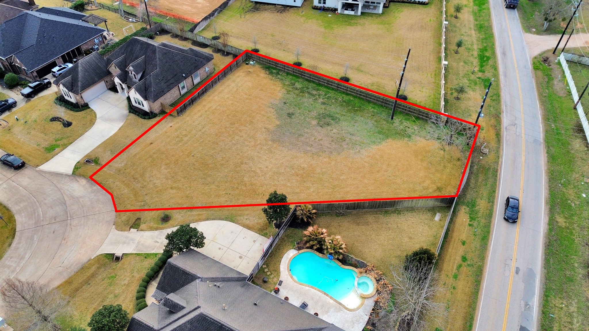33231 Worthing Lane Fulshear, TX 77441 - Photo 28 of 28 an aerial view of a house with a swimming pool