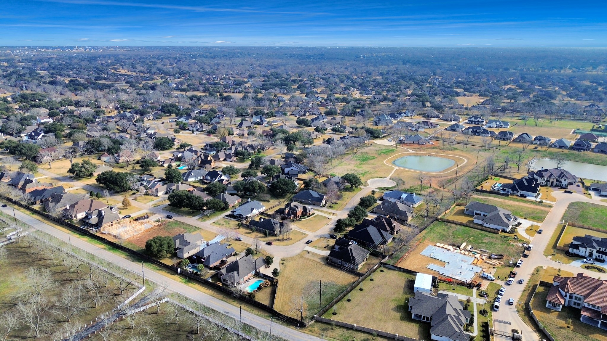33231 Worthing Lane Fulshear, TX 77441 - Photo 3 of 28 an aerial view of a city with lots of residential buildings